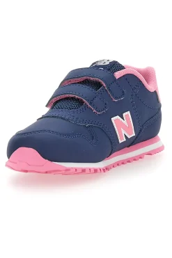 Blaue Sneakers New Balance 500 mit rosa Details und Klettverschluss